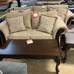 Brand new couch and loveseat for 1400 three-piece cocktail table set 399