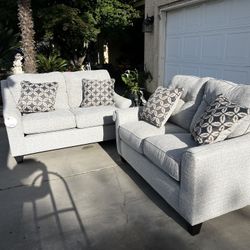 Brand New. (Set of 2) Lane Love Seat Sofa’s. Tweed color with accent pillows.  $549