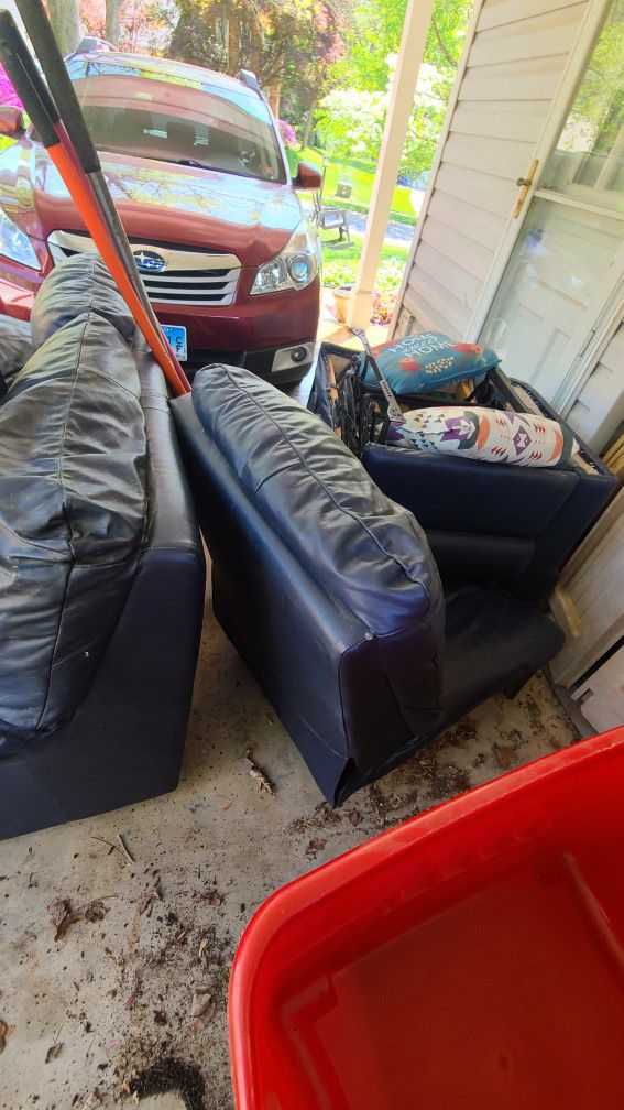 Free Blue Reclining Couch And Matching Loveseat.