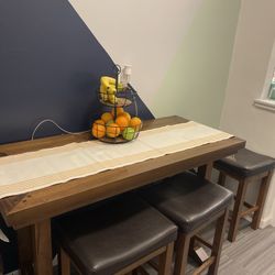 Dark wood dining table with matching chairs