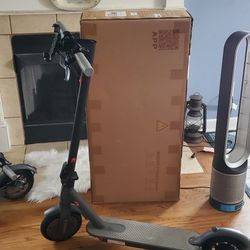 New In Box Scooter Shown Behind 