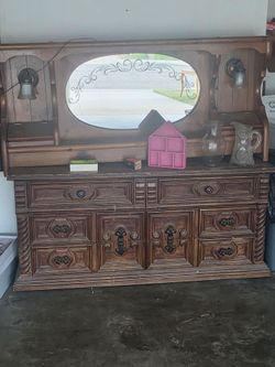 Sold wood dresser and a head board wth light ls bult in