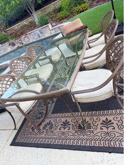 Outdoor taupe color dining set, 6 chairs and glass top