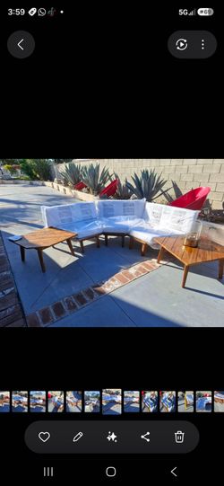 stunning vintage mid-century modern sectional sofa paired with coordinating wood coffee and side tables.