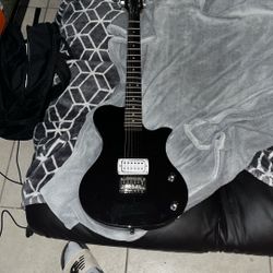 First Act Electric Guitar. Comes With AMP And Stand