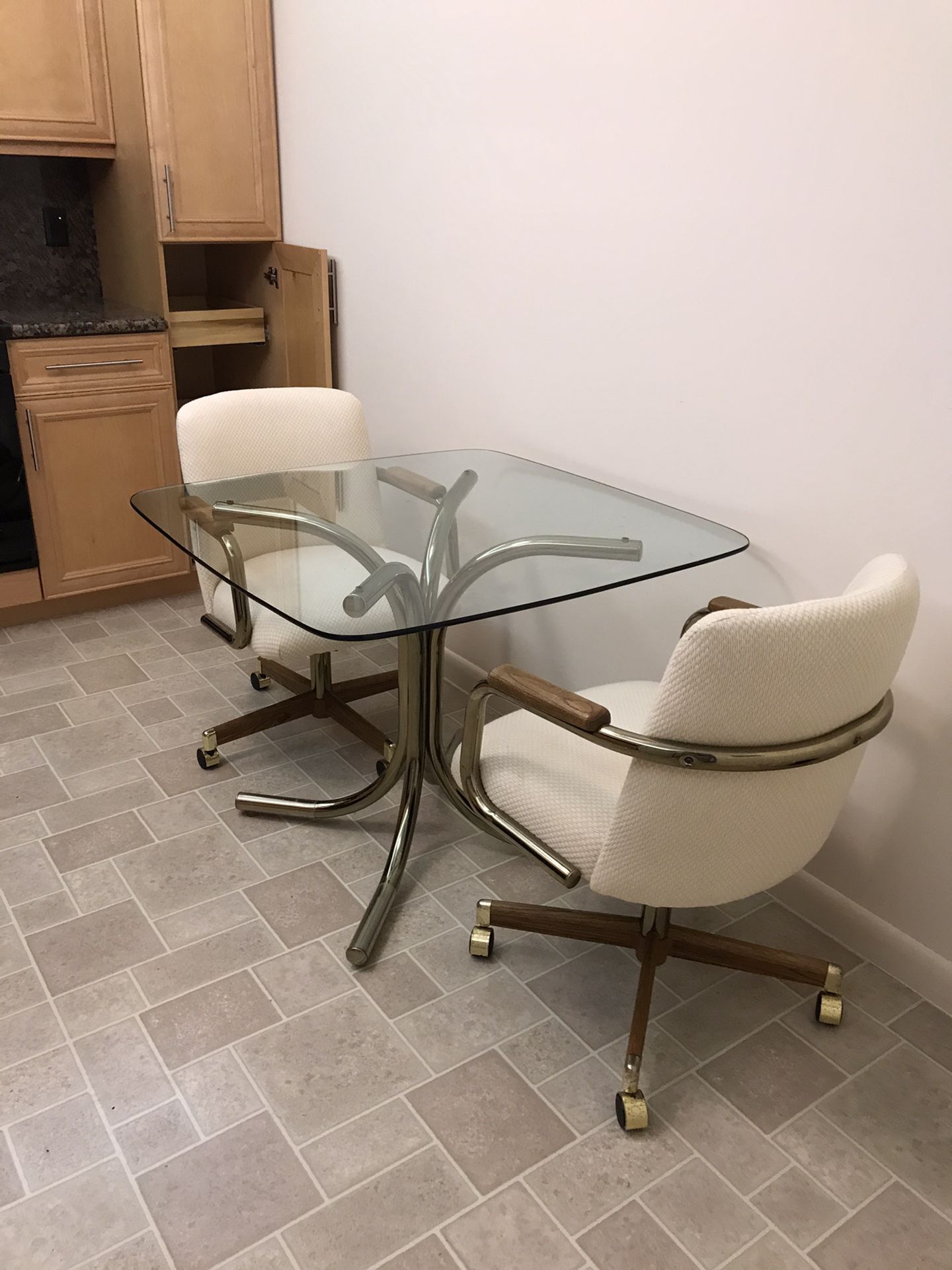 Kitchen table with two chairs on wheels very nice and clean comfortable