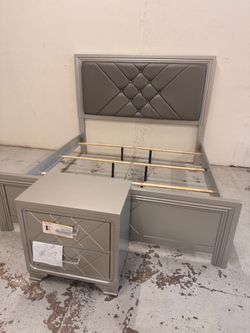 Silver upholstered king size bed frame with nightstand