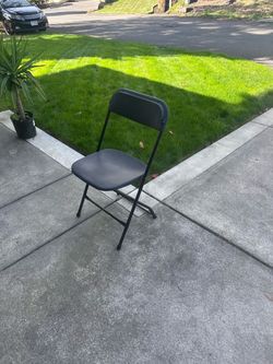 Black folding chairs - 7 available