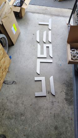 Aluminum Tesla letters