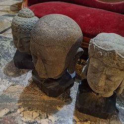 3 carved stone heads of Buddha