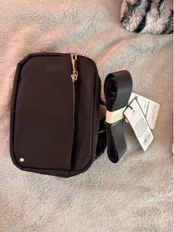 gold hardware black bag