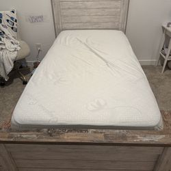 Twin bed with box spring and mattress