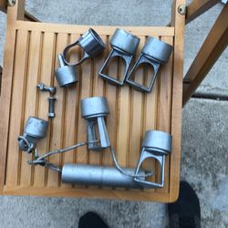Seven aluminum fence caps