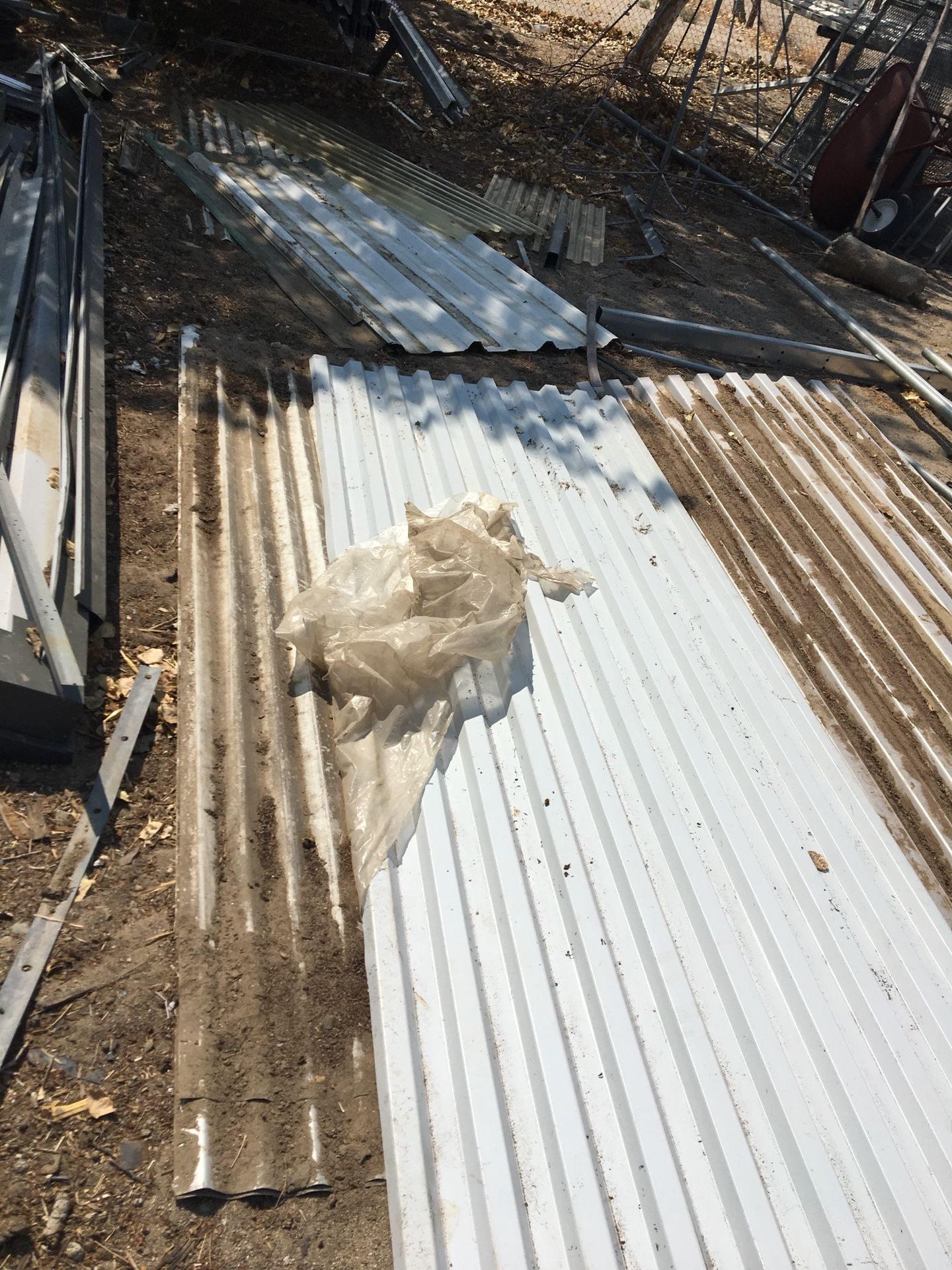 Corrugated metal sheets for roofing