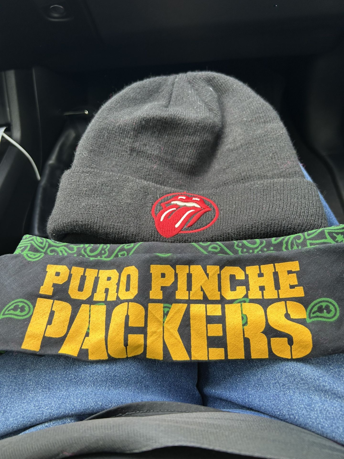 Hat Of Rolling Stones And Headband Of The Green Bay Packers