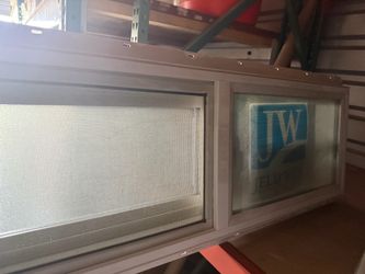 2 New Vinyl dual glazed windows 36” x 12” horizontal