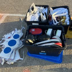 Large lot of karate, gear, sparring pads, uniforms, and belts