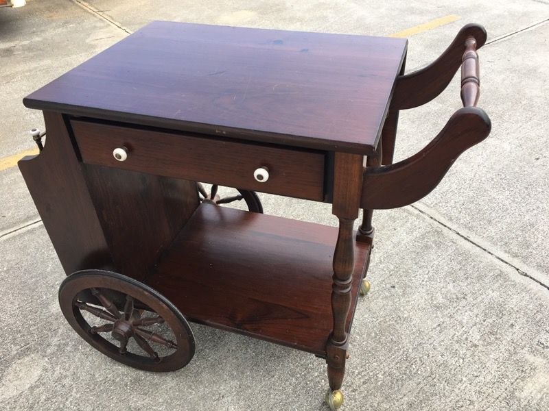 Vintage mid century rolling leaf tea serving cart . Brown wooden in great shape.