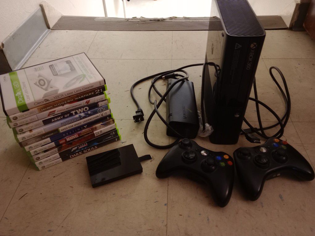 4gb Xbox 360 E w/ cables, 2 controllers, 128gb hard drive, and 10 games