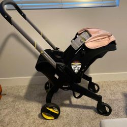 BABY GIRL DOONA STROLLER/CAR SEAT ALL IN ONE