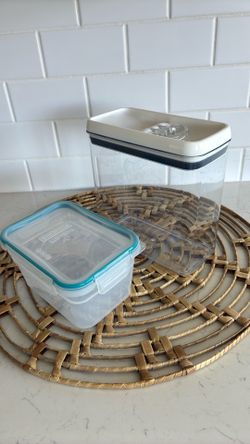 Two kitchen storage containers with lids