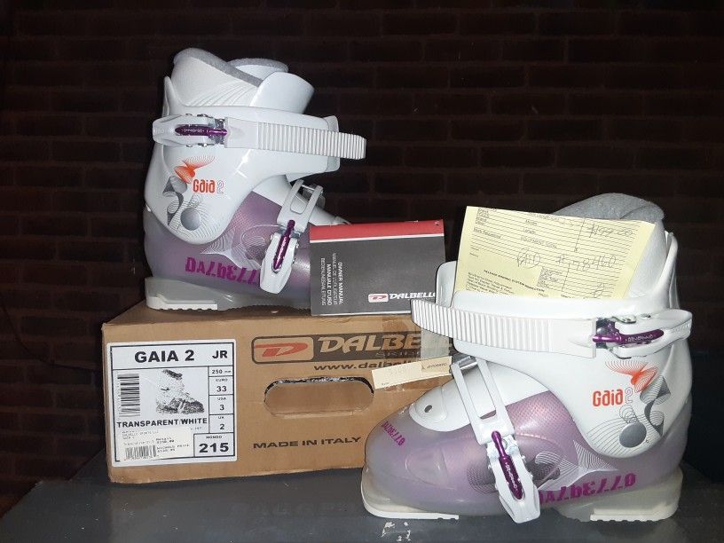 New Ski Boots And 2 Pairs Of Skis