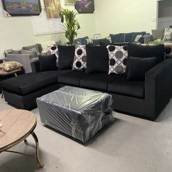Black Sectional With Designed Pillows 