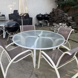 Glass table and 4 chairs for sale!