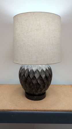 Bronze colored table lamp with shade