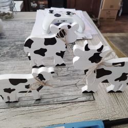 Family Of Wooden Cow Figurines 