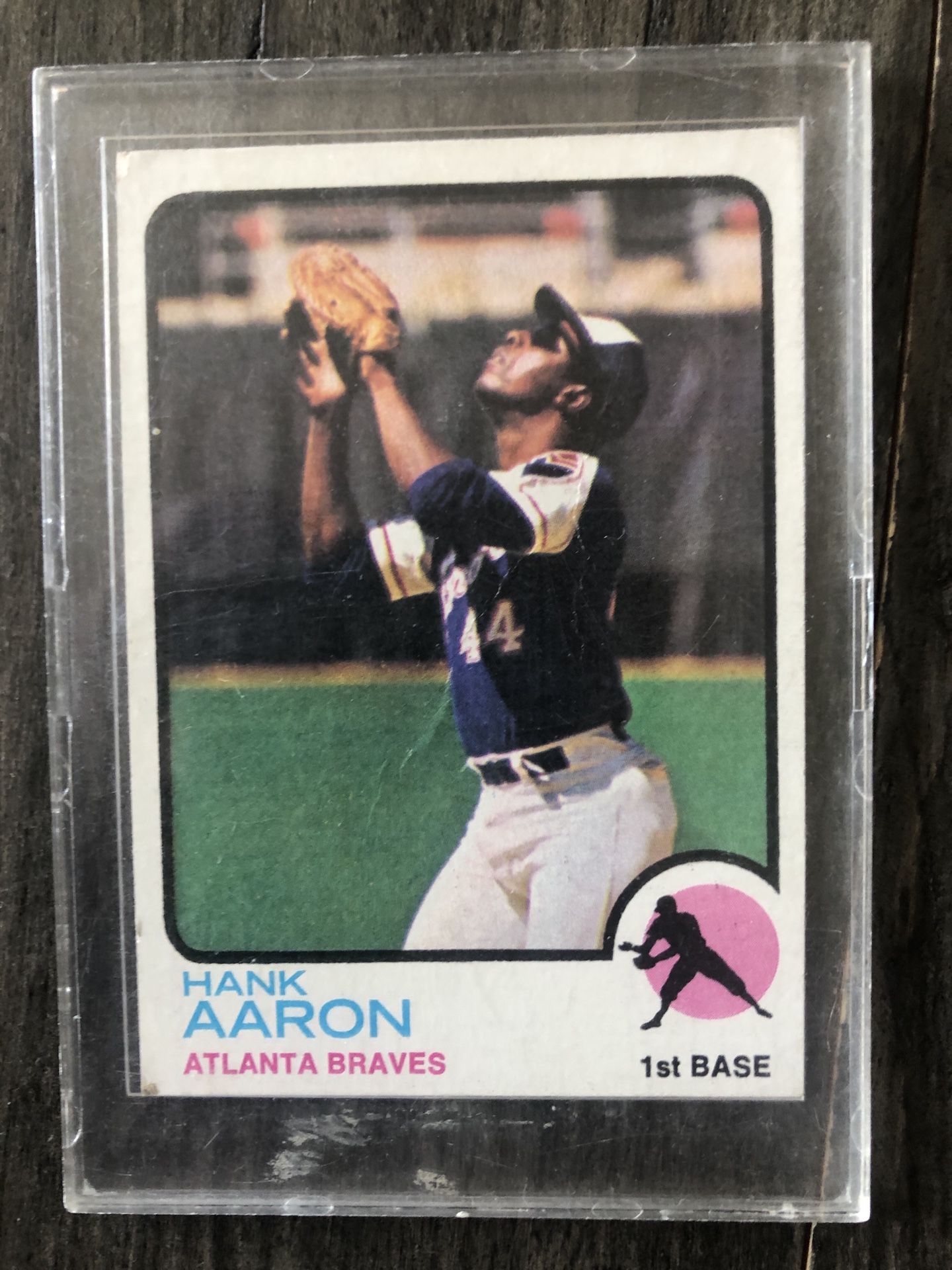 1973 Topps Hank Aaron Baseball Card #100. There is some damage to the back of the card but the front is in great condition!