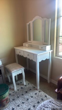 Vanity with mirror and chair