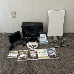 Black Wii with motion plus, 6 games and fit board