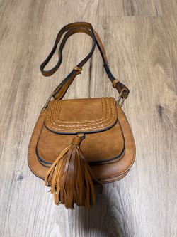 Brown leather crossbody bag with tassel detail #crossbody #tassel #boho