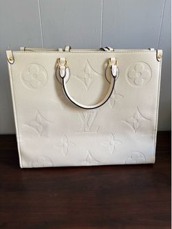 Louis Vuitton OnTheGo GM in cream-colored Monogram Empreinte leather