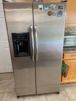 GE stainless steel side y side refrigerator/freezer for sale