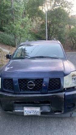 Nissan armada truck need gone ! Work truck runs great Radio loud