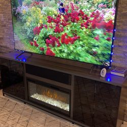 Large TV stand with fireplace and strong speakers