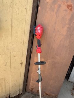 Milwaukee M18-16 brushless cordless string trimmer with battery