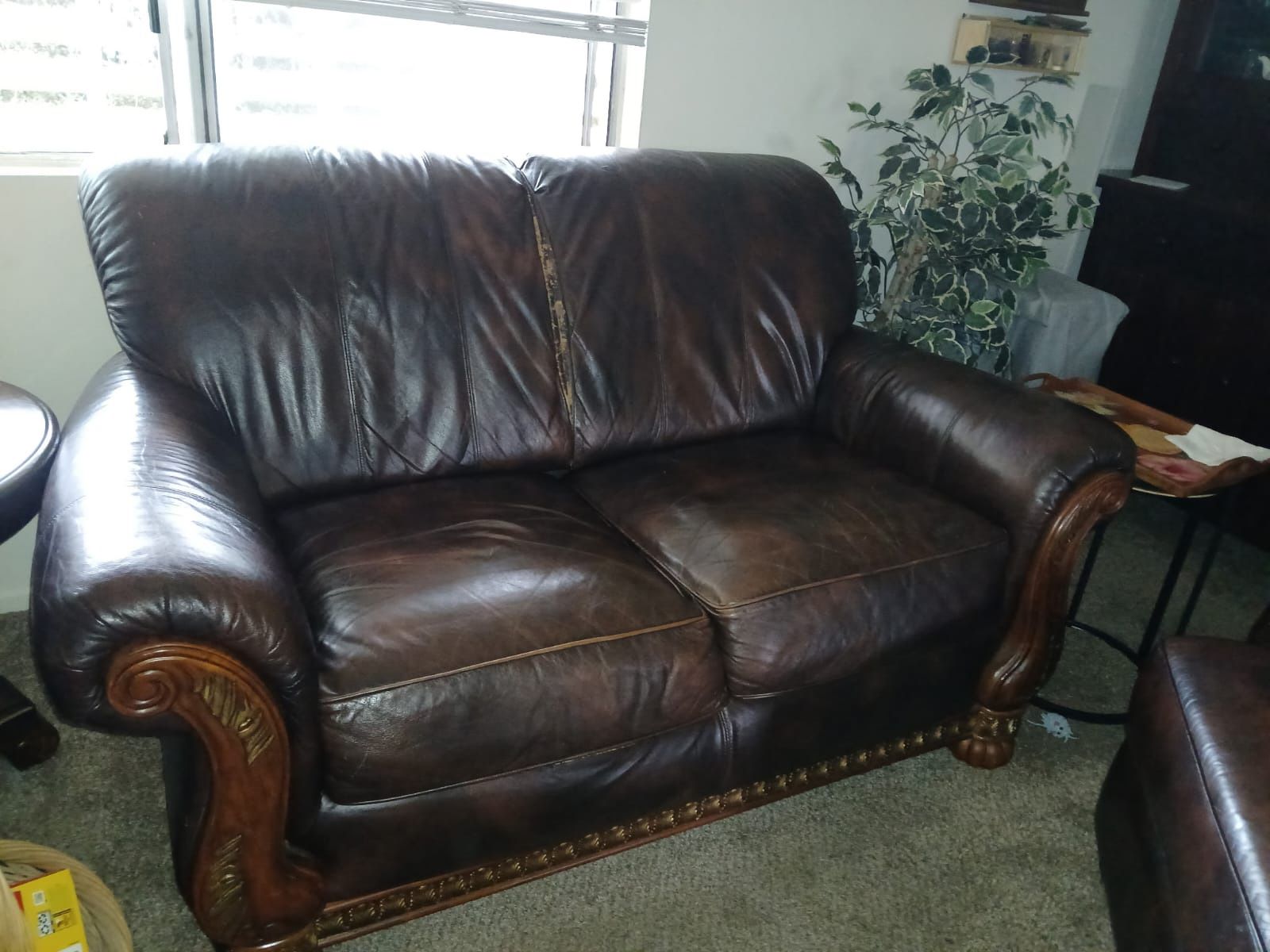 Deep brown leather couches with foot rest