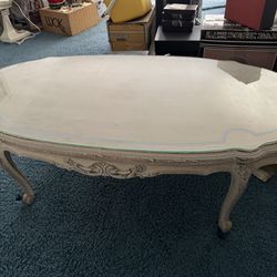 vintage white French Provincial coffee table with glass top