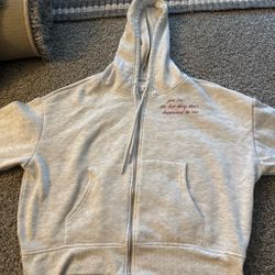 Light Gray Zip-Up Hoodie with Embroidered Text