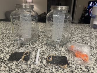 Selling a set of two (2) 1-gallon glass drink dispensers, perfect for parties, gatherings, holidays, BBQs, and events. Brand new, Only Used Once. 