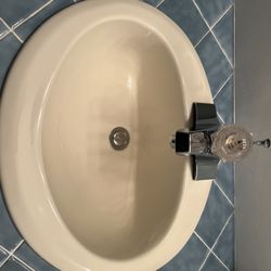 Bathroom Top Mount Almond Color Sink And Delta Faucet