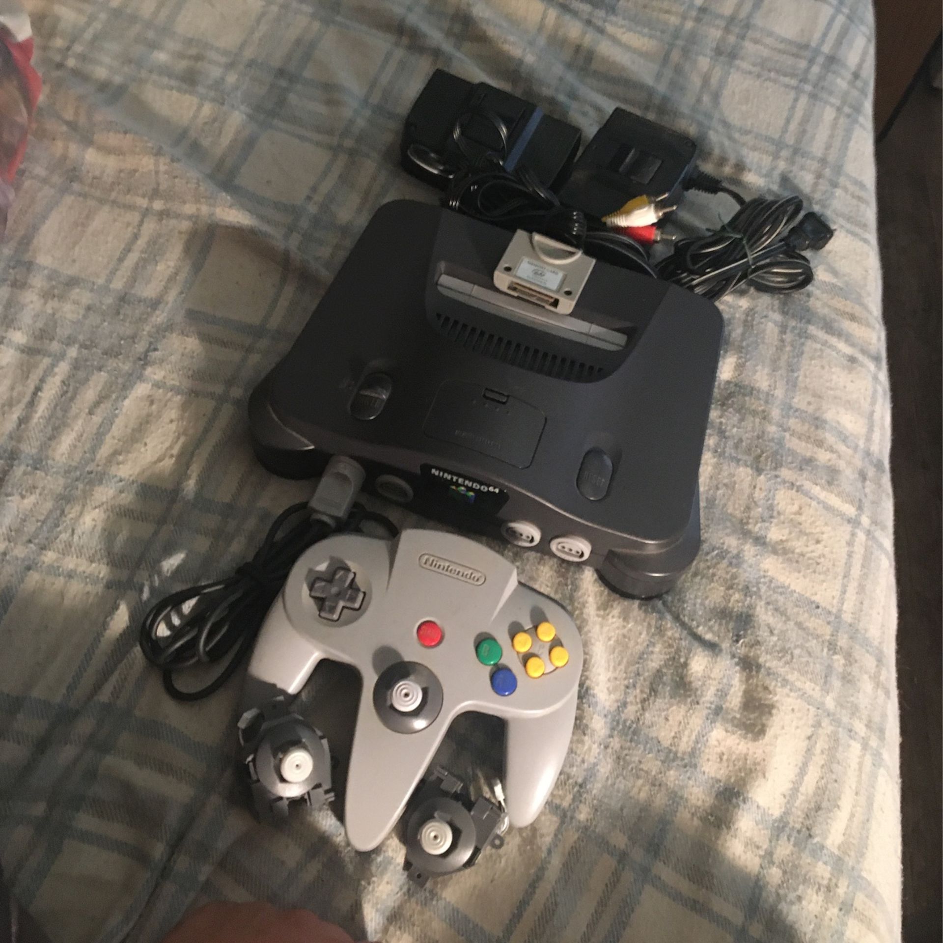 Nintendo’s 64 Console with 1 Original Controller, 1 Memory Pack, 2 Replacement Joysticks, and 2 Power Bricks!