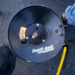 a Rapid Reel brand hose reel. Rapid Reel products are industrial and resi