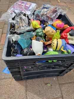 Milk crate full of vintage mcdonalds chuck e cheese burger king toys