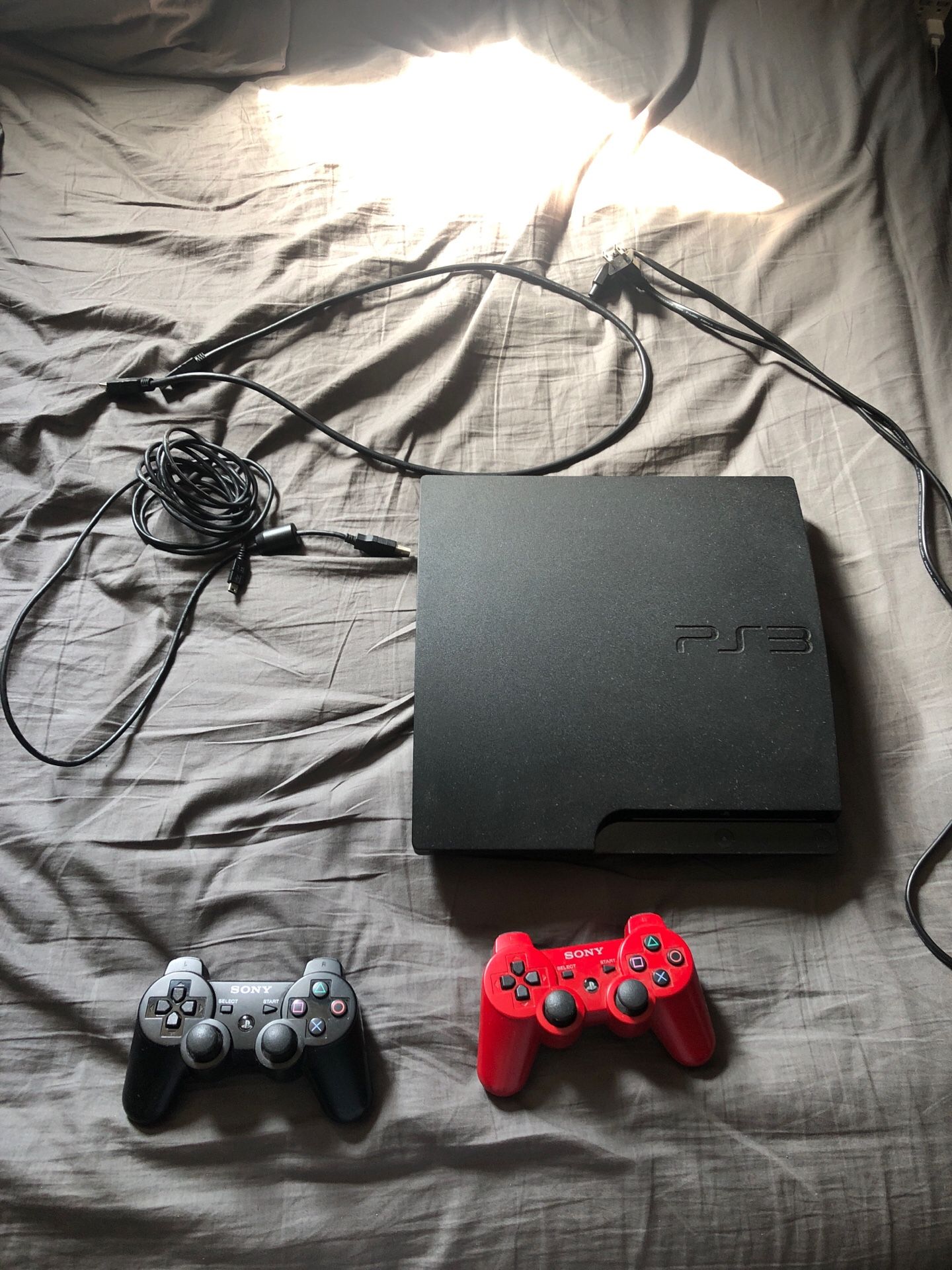 PS3 Slim with all cords and two controllers