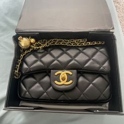CHANEL Black Quilted Crossbody Bag with Gold Accents