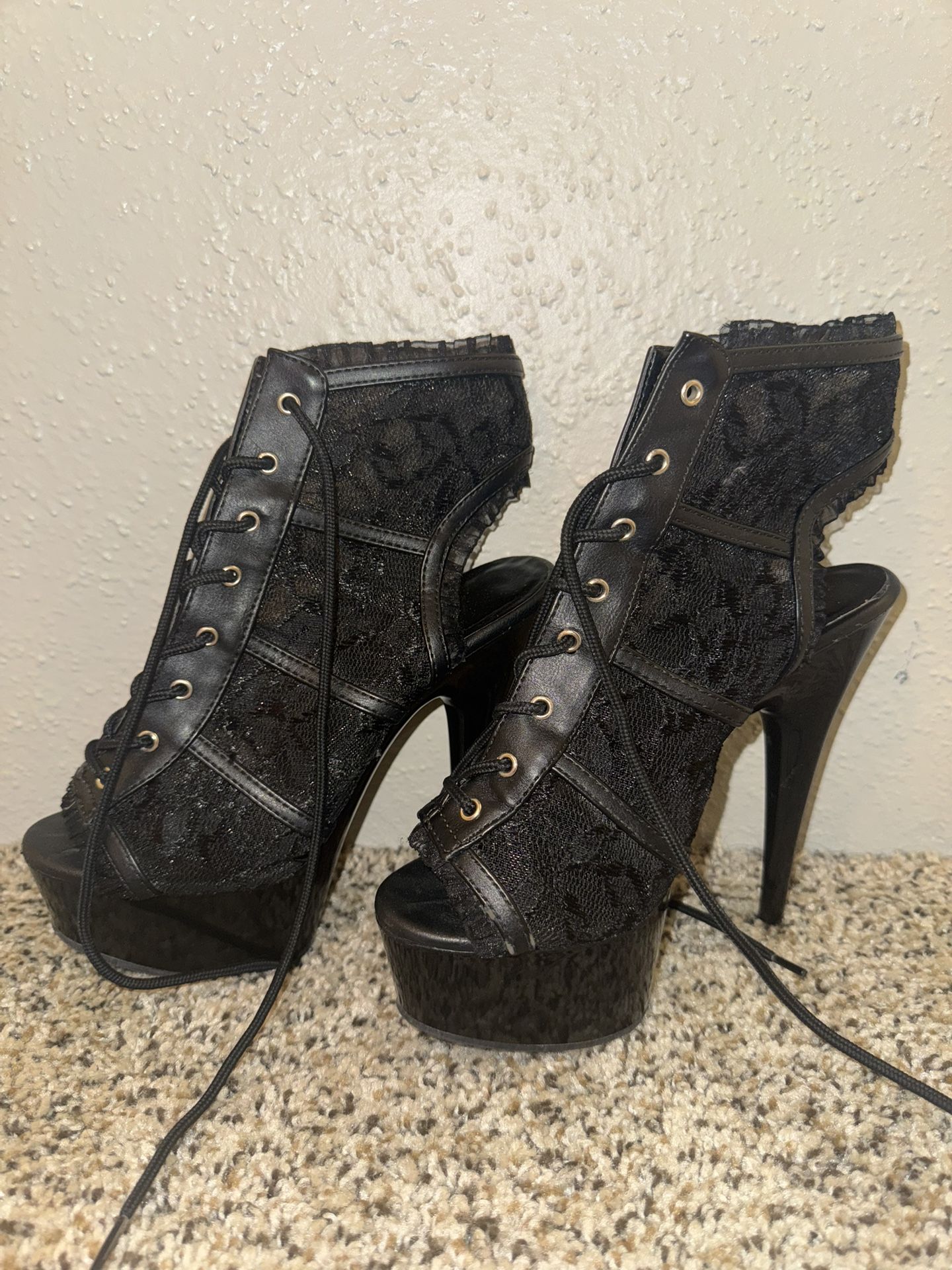 Black lace-up platform heels with a 5" heel
